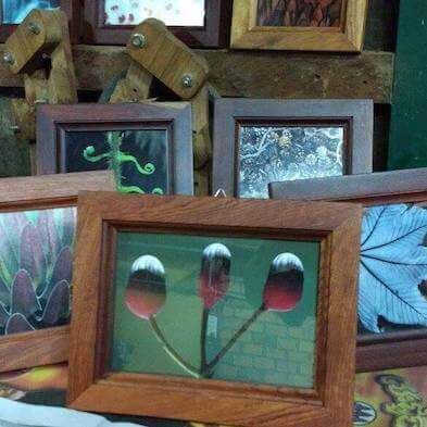 An assortment of picture frames  made from discared wood.