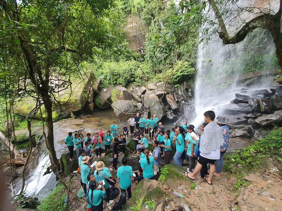 Plas Prai studednts attending a  baptism at the waterfalls.