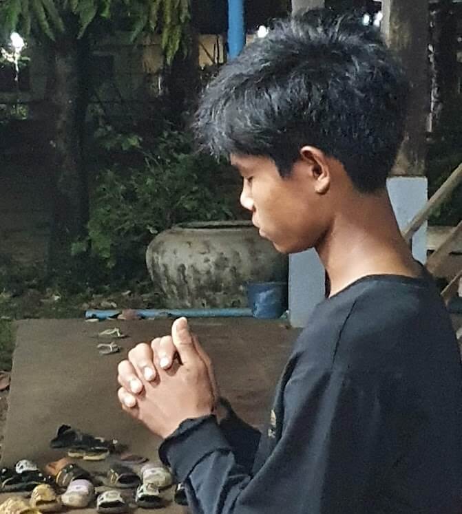 Student praying.